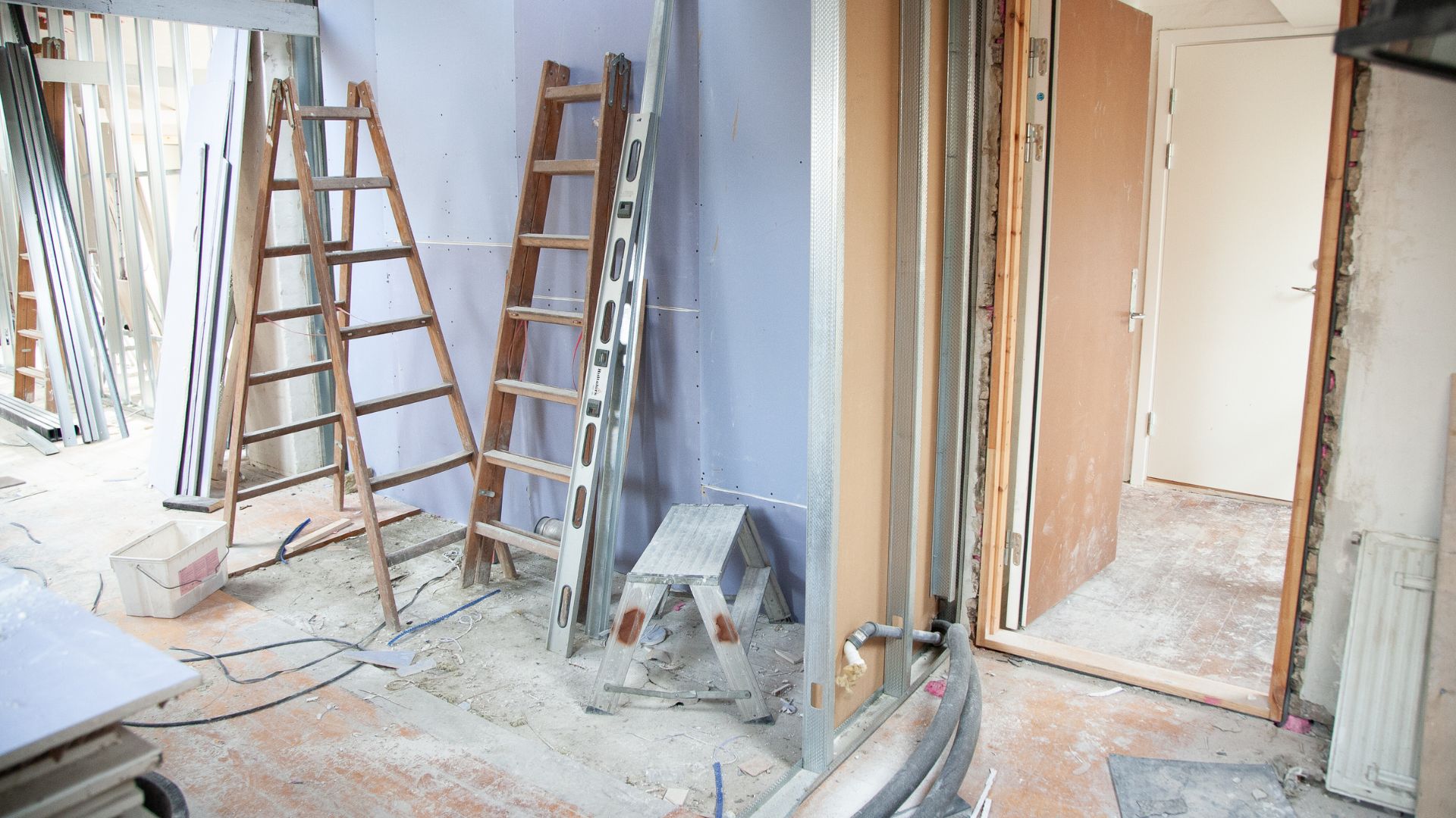 A room that is being remodeled with a ladder
